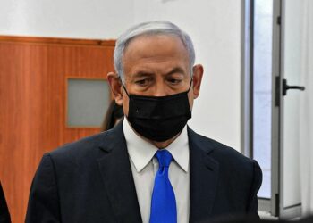Israeli Prime Minister Benjamin Netanyahu arrives to a hearing in his corruption trial at the Jerusalem district court, on February 8, 2021. - Israel's Prime Minister Benjamin Netanyahu returns to court to formally respond to the corruption charges against him, as his trial enters an intensified phase six weeks before he faces re-election. (Photo by - / POOL / AFP)
