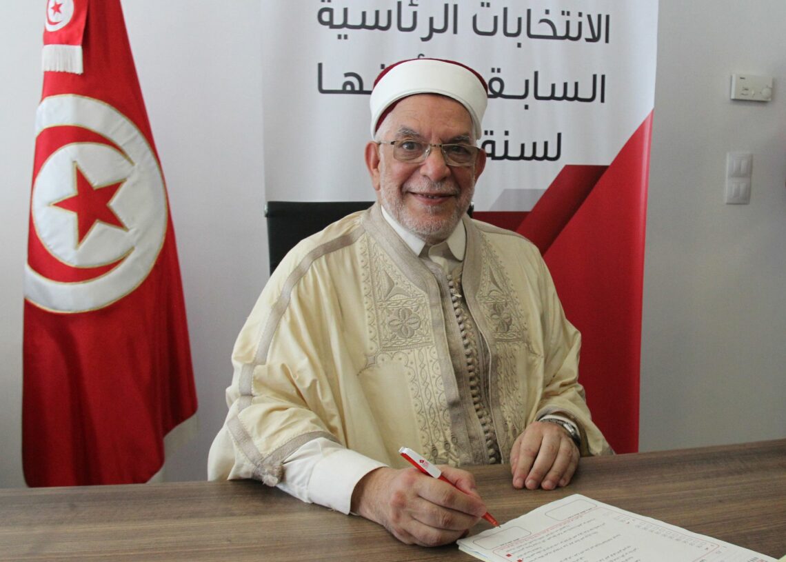 (FILES) In this file photo taken on August 09, 2019, Abdelfattah Mourou, Tunisia's interim parliamentary speaker and Islamist-inspired Ennahda Party politician, submits his candidacy for the upcoming early presidential elections at the Independent High Authority for Elections (ISIE) in the capital Tunis - Chastened by its early experiences of holding power in post-revolution Tunisia, Islamist-inspired party Ennahdha has moderated its image and selected lawyer Abdelfattah Mourou as its candidate for next Sunday's presidential election. (Photo by HASNA / AFP)