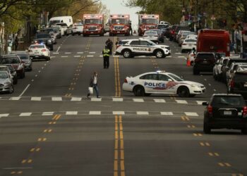 WASHINGTON, DC - APRIL 22: A row of ambulances stand at the crest of a hill along Connecticut Avenue Northwest after a shooting in the area left at least three people injured on April 22, 2022 in Washington, DC. Police evacuated residents from around the shooting Friday afternoon and there was a person arrested at the scene.   Chip Somodevilla/Getty Images/AFP
== FOR NEWSPAPERS, INTERNET, TELCOS & TELEVISION USE ONLY ==